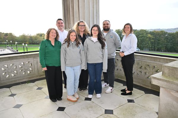 Photo shows members of Be Cyber Safe NI with their youth leader, along with CiNI CEO and CiNI Head of Policy, and the NSPCC. They are standing on the balcony at Parliament Buildings Stormont. 
