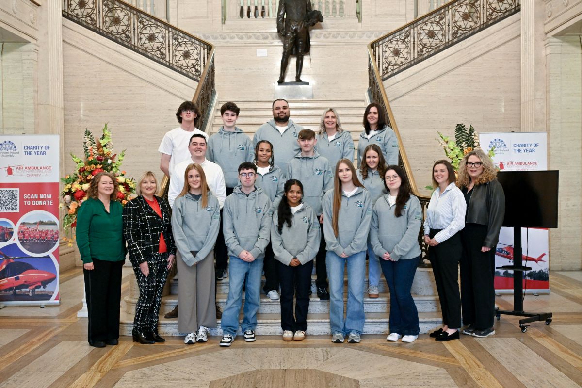 Group photo of members from Be Cyber Safe NI pictured on the steps at Parliament Buildings Stormont along with staff from Children in Northern Ireland and NSPCC