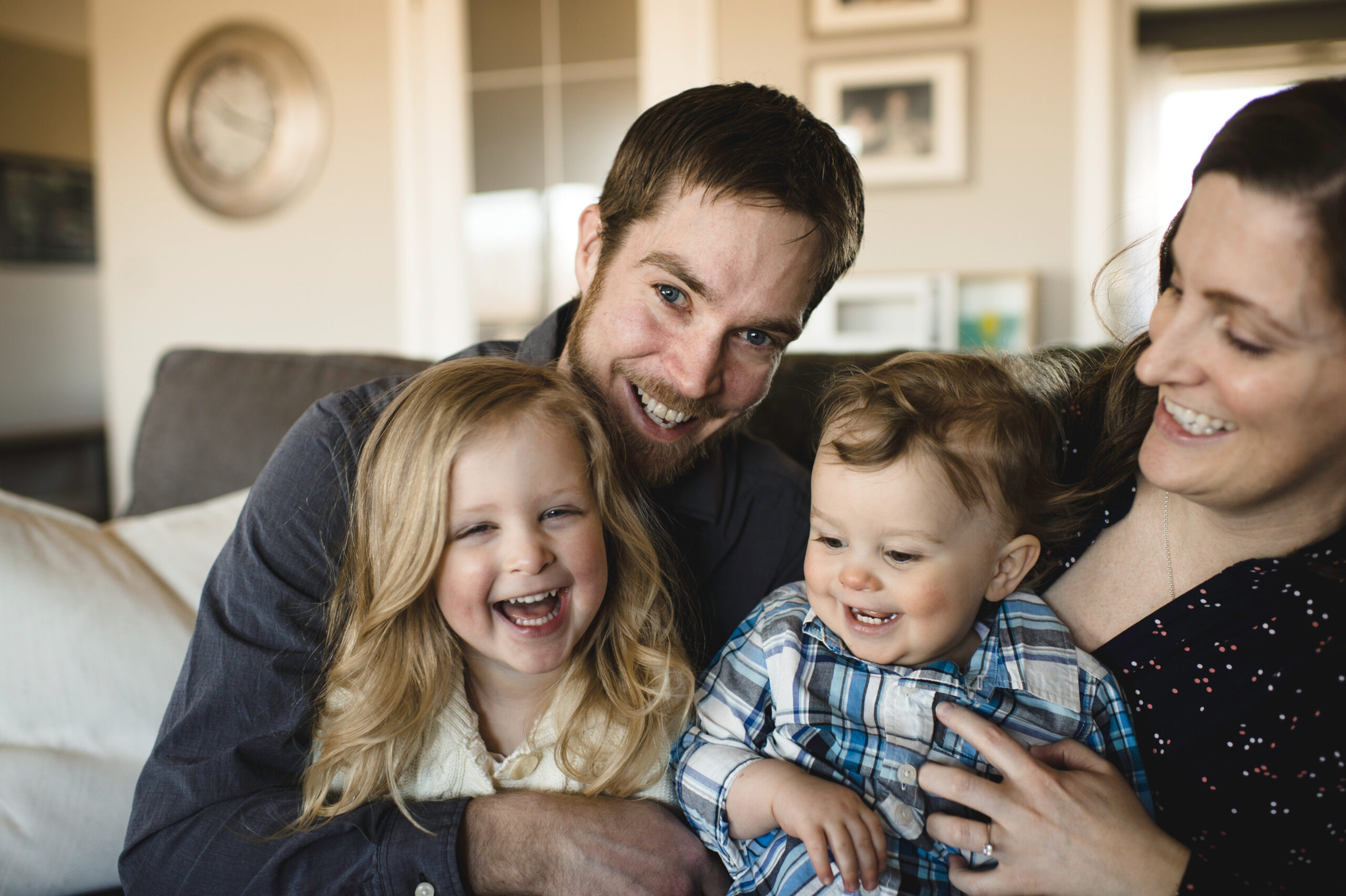 Happy family on sofa at home